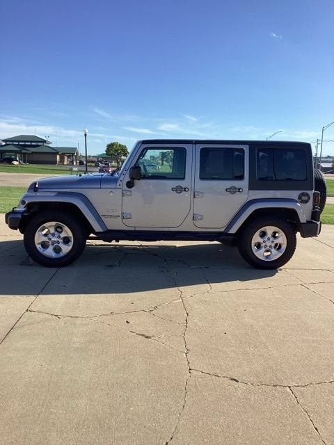 Used 2015 Jeep Wrangler Unlimited Sahara with VIN 1C4BJWEGXFL556483 for sale in Waverly, IA